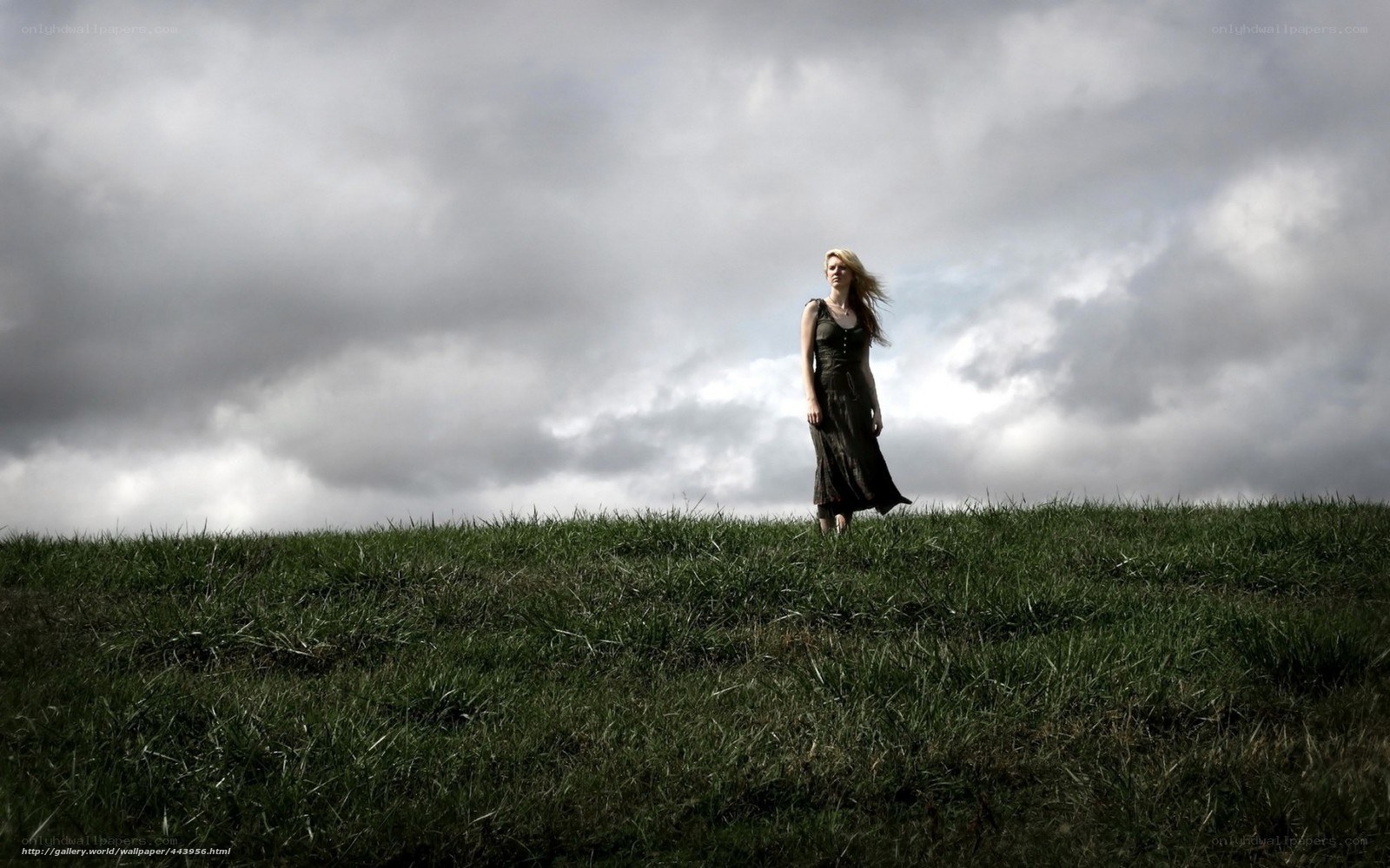 Woman on a grassy hill