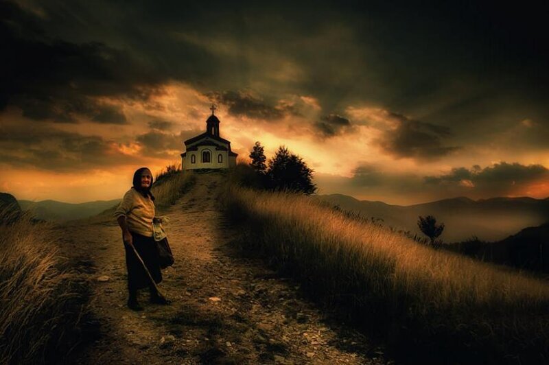 Woman on a Hillside Path — Orange