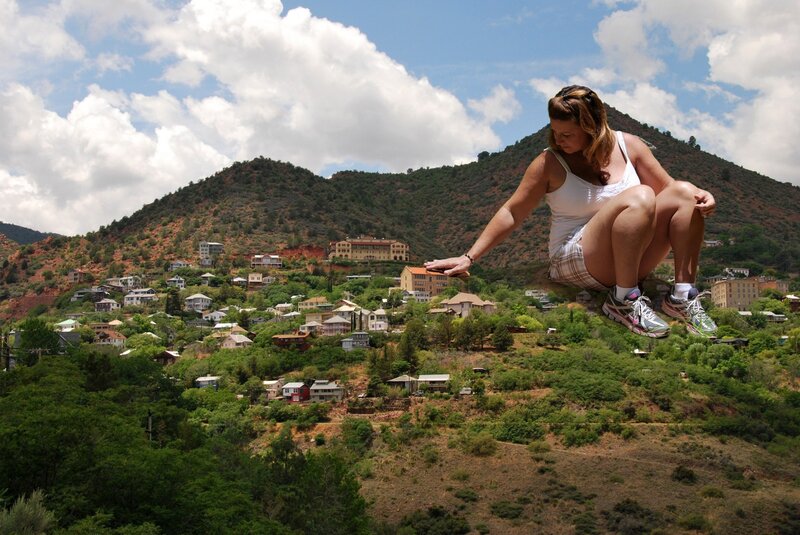 Woman on a hillside with town view
