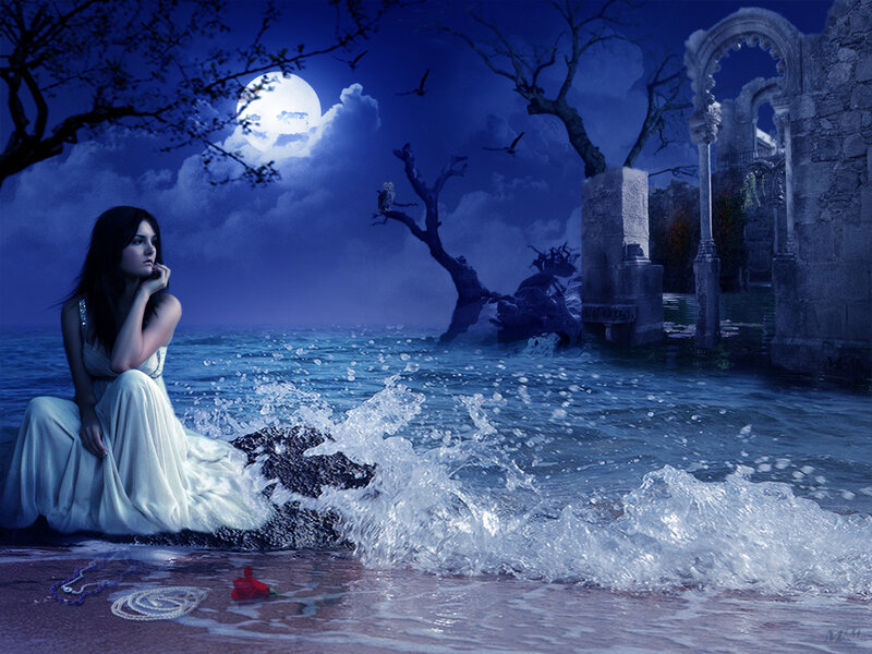 Woman on a moonlit beach