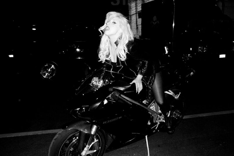 Woman on a motorcycle at night