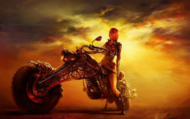 Woman on a motorcycle at sunset