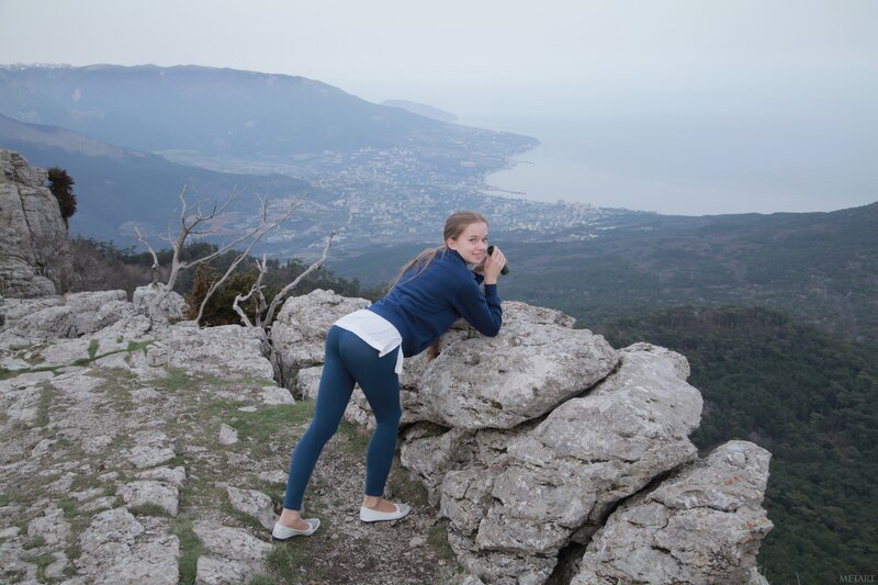 Woman on a mountain peak