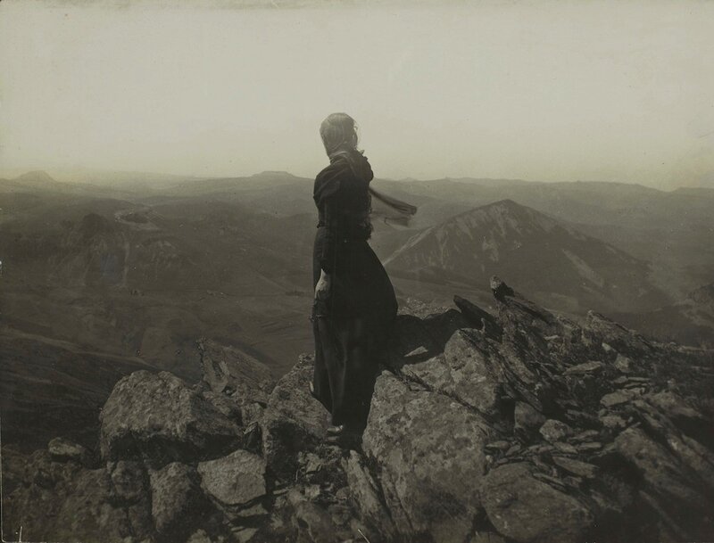 Woman on a mountain peak