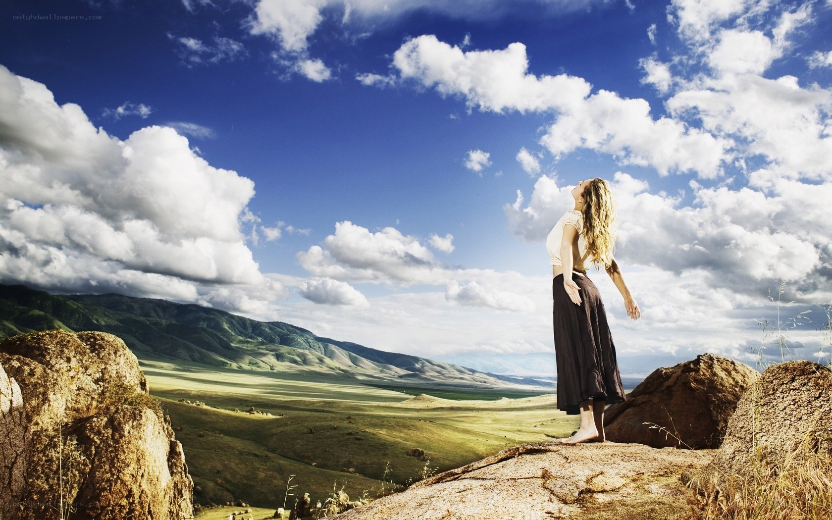 Woman on a mountain peak