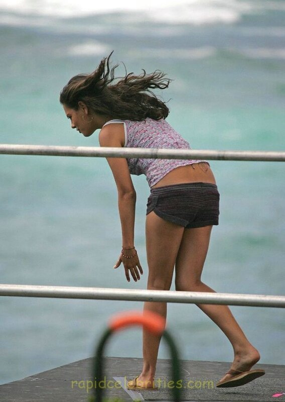 woman on a pier by the ocean