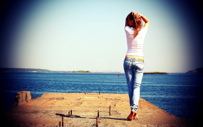 woman on a pier by the water