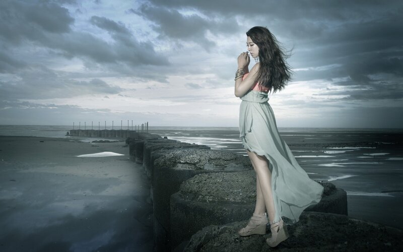 Woman on a Pier — Gray, Dramatic