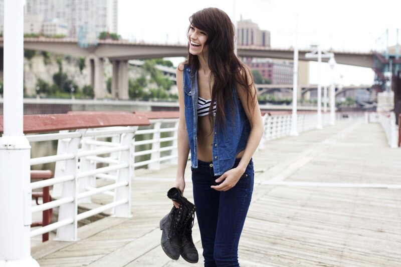 Woman on a pier with boots