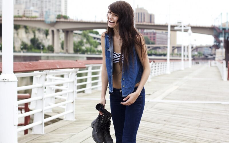 Woman on a pier with boots