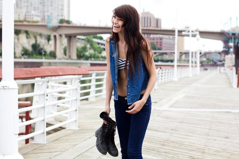 Woman on a pier with boots