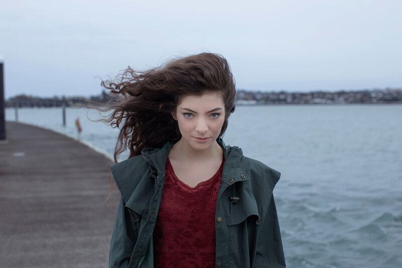 woman on a pier with wind-blown hair