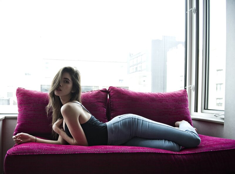 woman on a pink couch