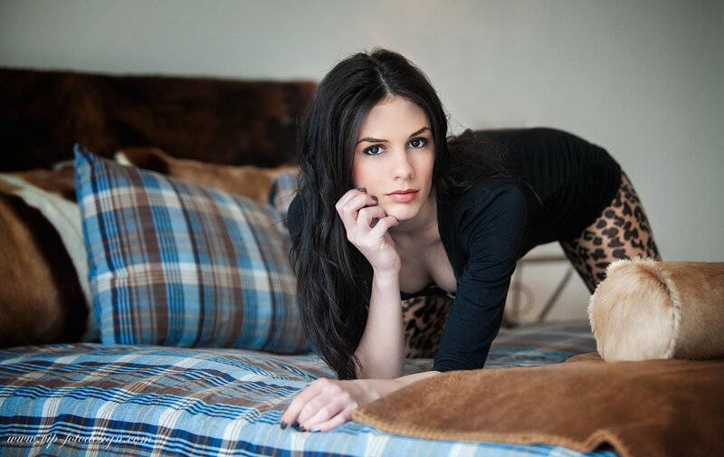 woman on a plaid bed