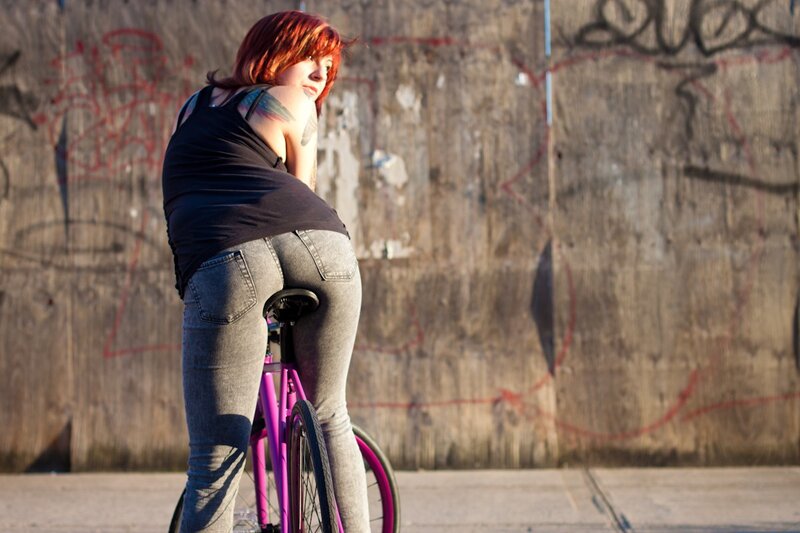 Woman on a purple bike