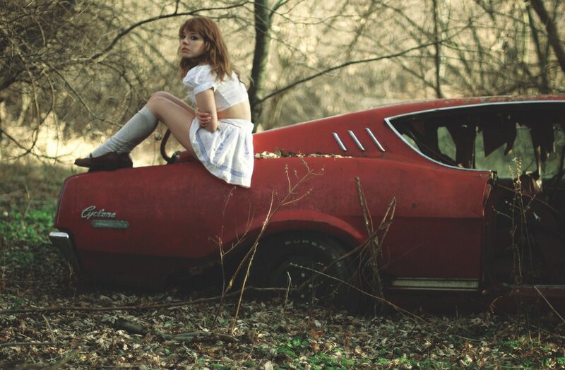 Woman on a red car