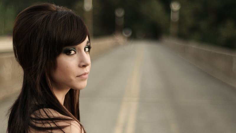 woman on a road at dusk