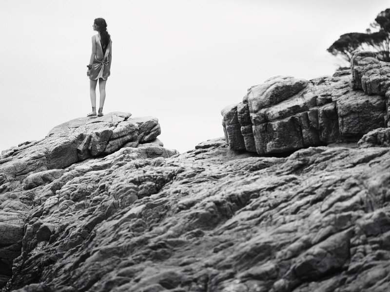 Woman on a rocky cliff