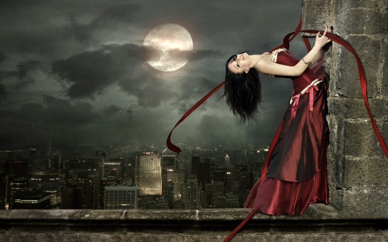 Woman on a rooftop at night
