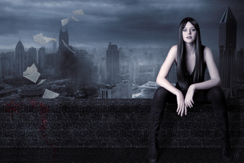woman on a rooftop at night