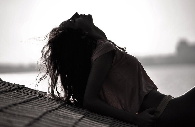 woman on a rooftop at sunset