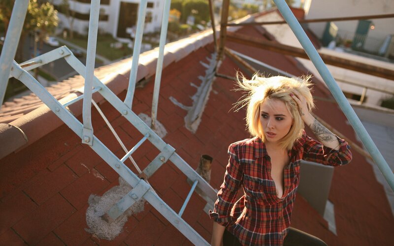 Woman on a rooftop at sunset