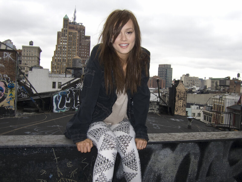 woman on a rooftop in the city