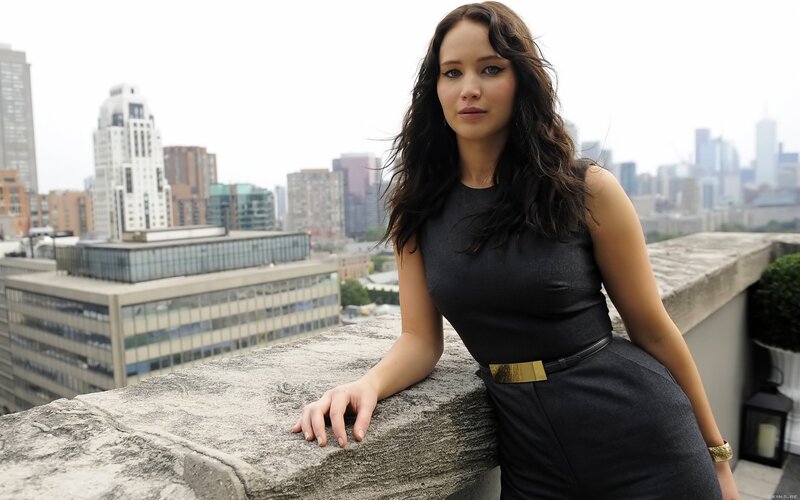 woman on a rooftop with city view