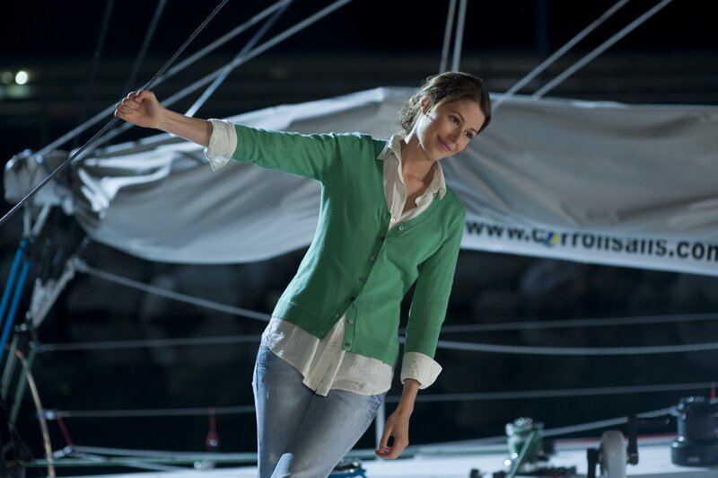 woman on a sailboat at night
