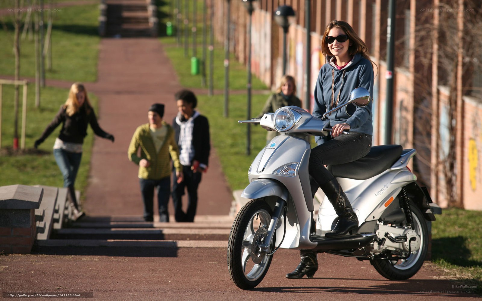 Woman on a scooter in a park