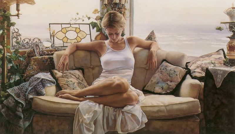 Woman on a sofa by the sea