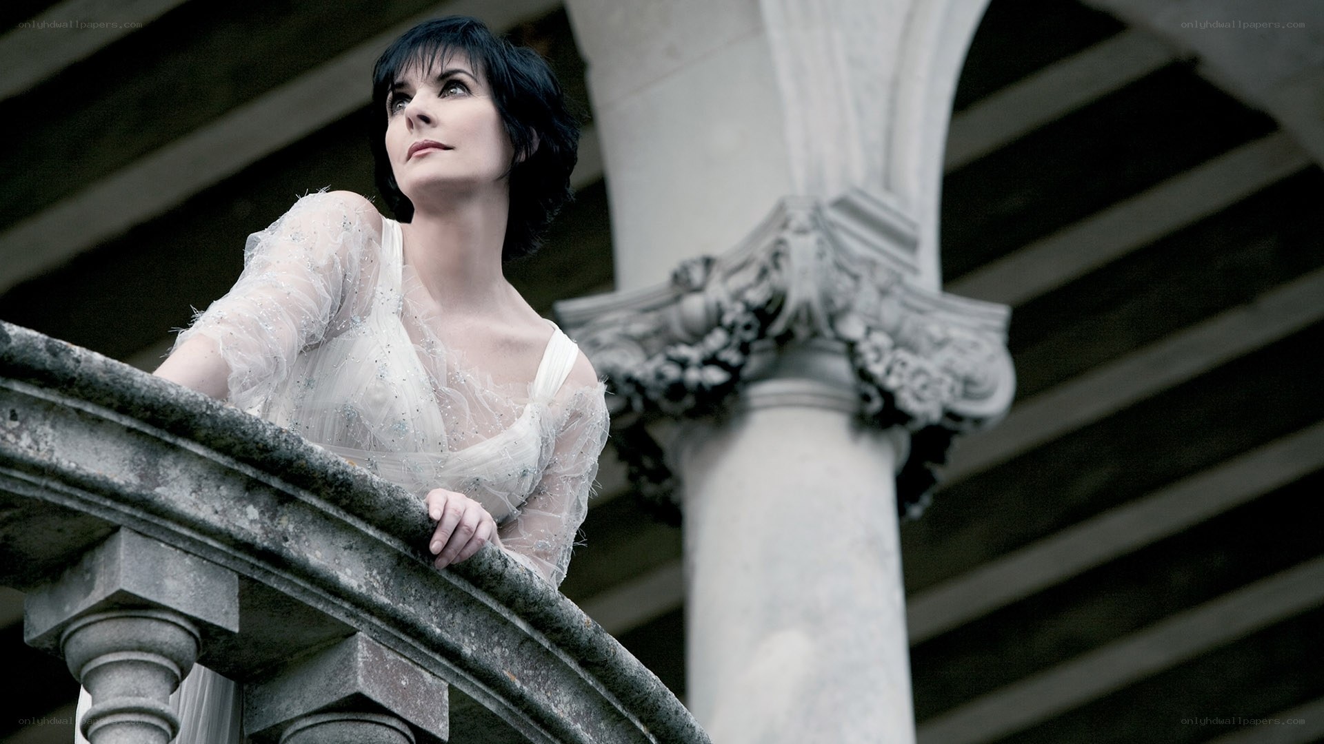 Woman on a stone balcony