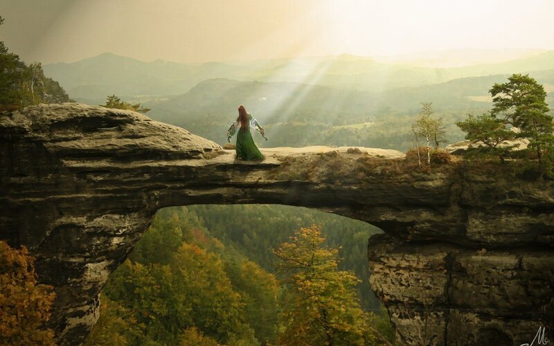woman on a stone bridge