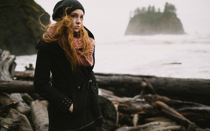 Woman on a stormy beach