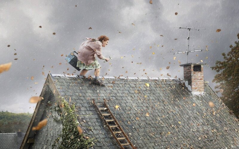 Woman on a stormy roof