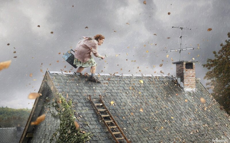 Woman on a stormy roof