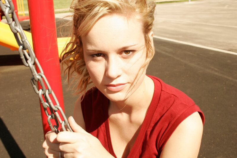 Woman on a swing at playground