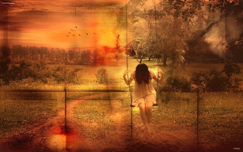 Woman on a swing at sunset