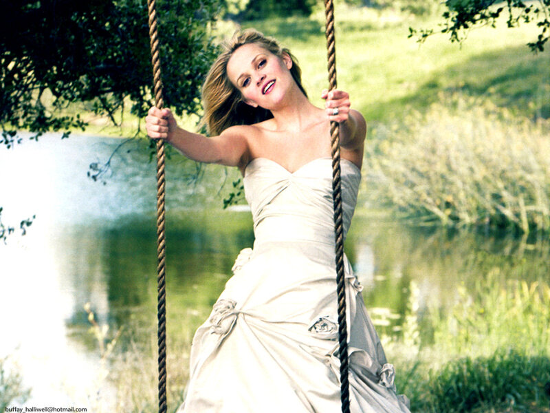 woman on a swing by water