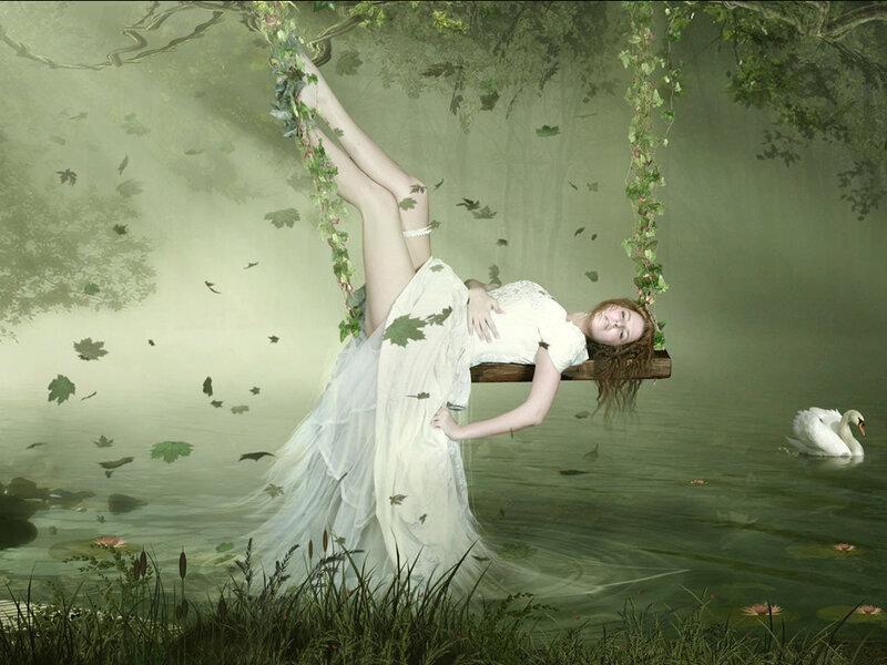 woman on a swing in a dreamy forest