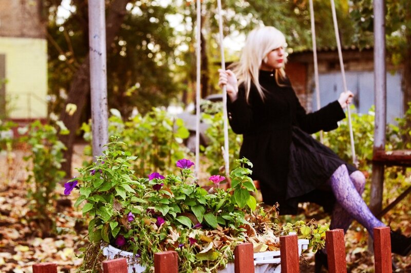 Woman on a swing in autumn