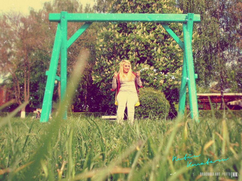 Woman on a swing in park