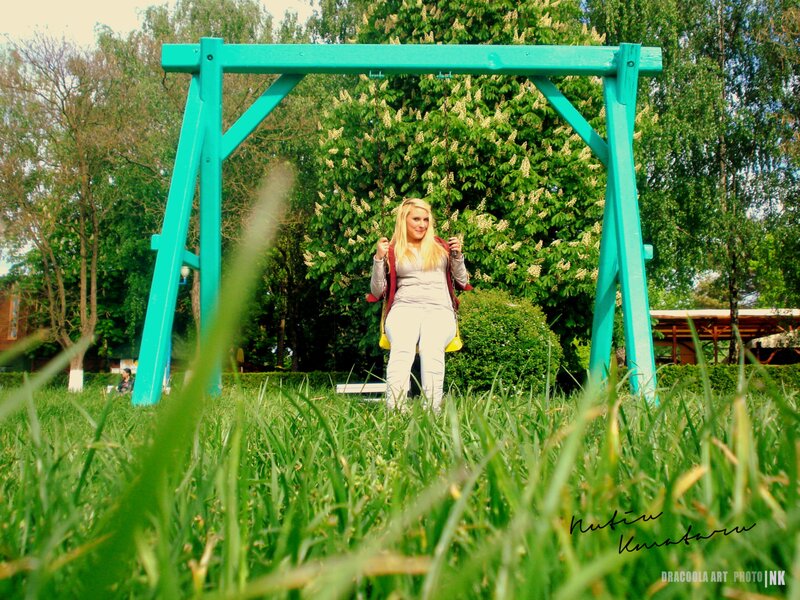 Woman on a swing in park