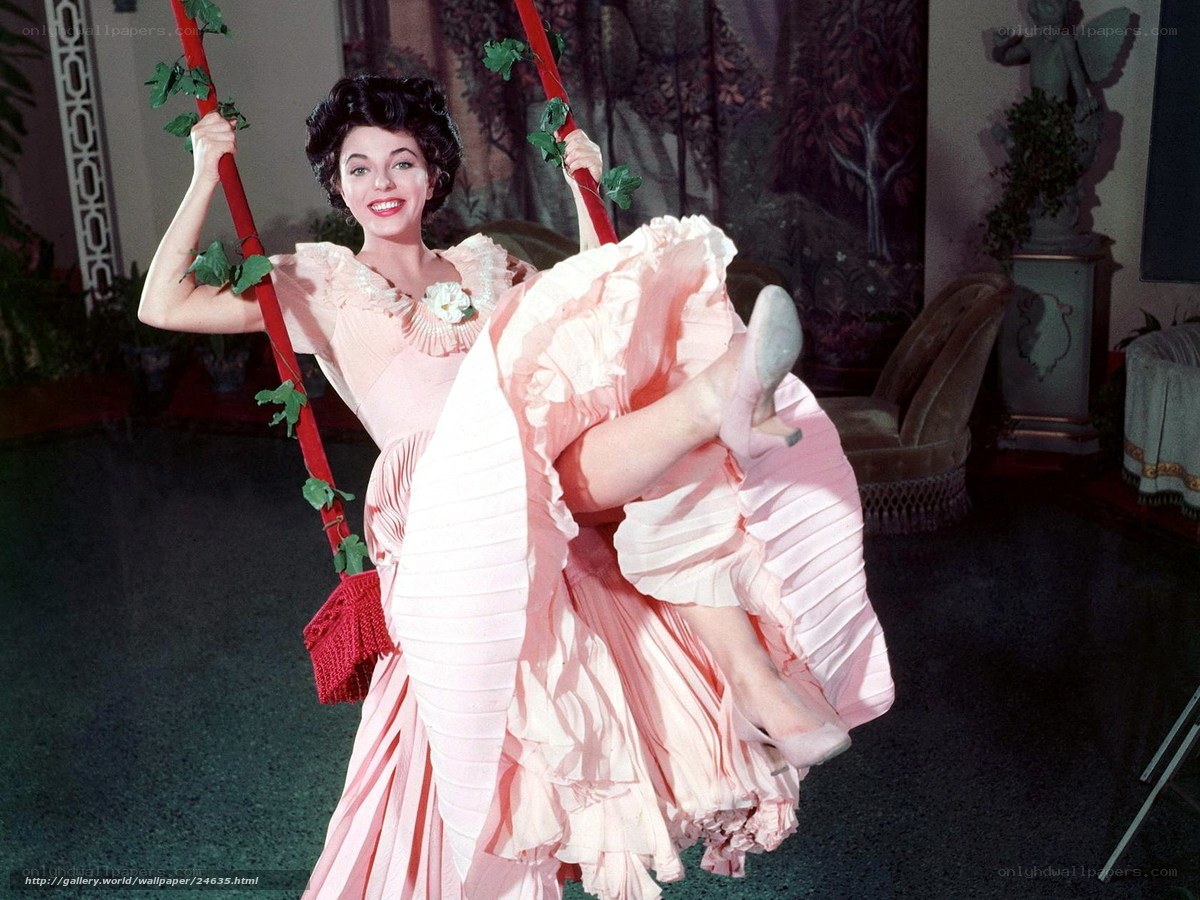 Woman on a swing in pink dress
