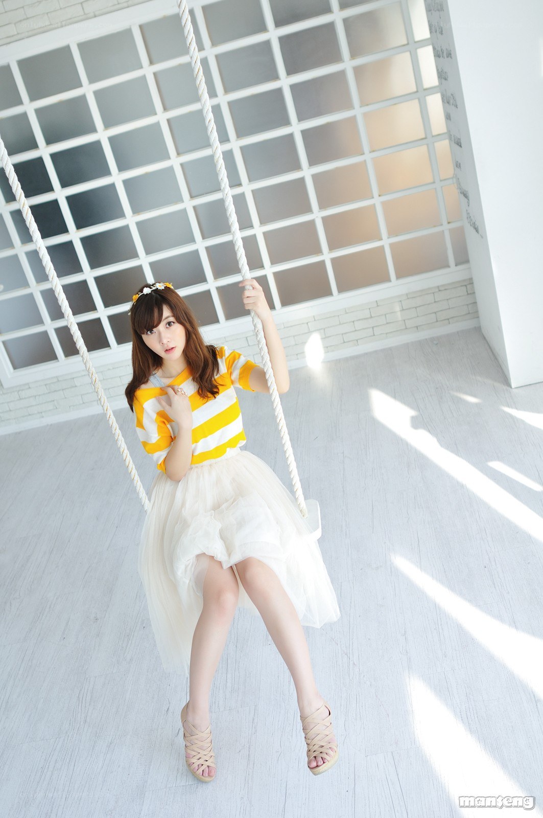 woman on a swing in studio