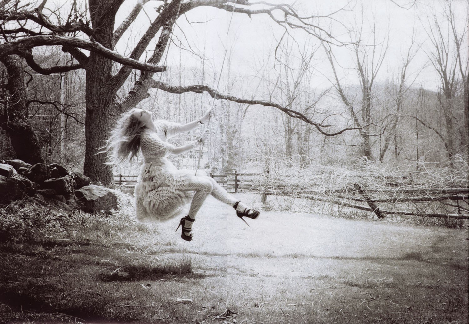 Woman on a swing in winter