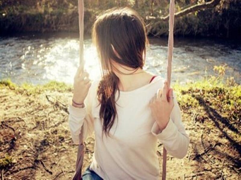 Woman on a Swing — White, Serene, Afternoon