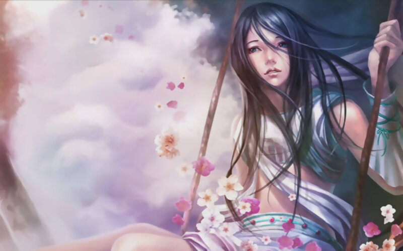 woman on a swing with cherry blossoms