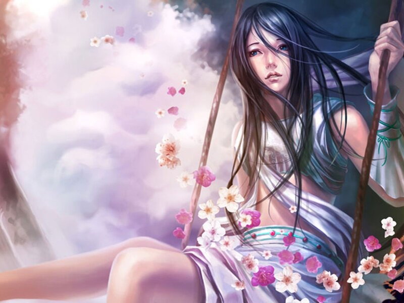woman on a swing with cherry blossoms