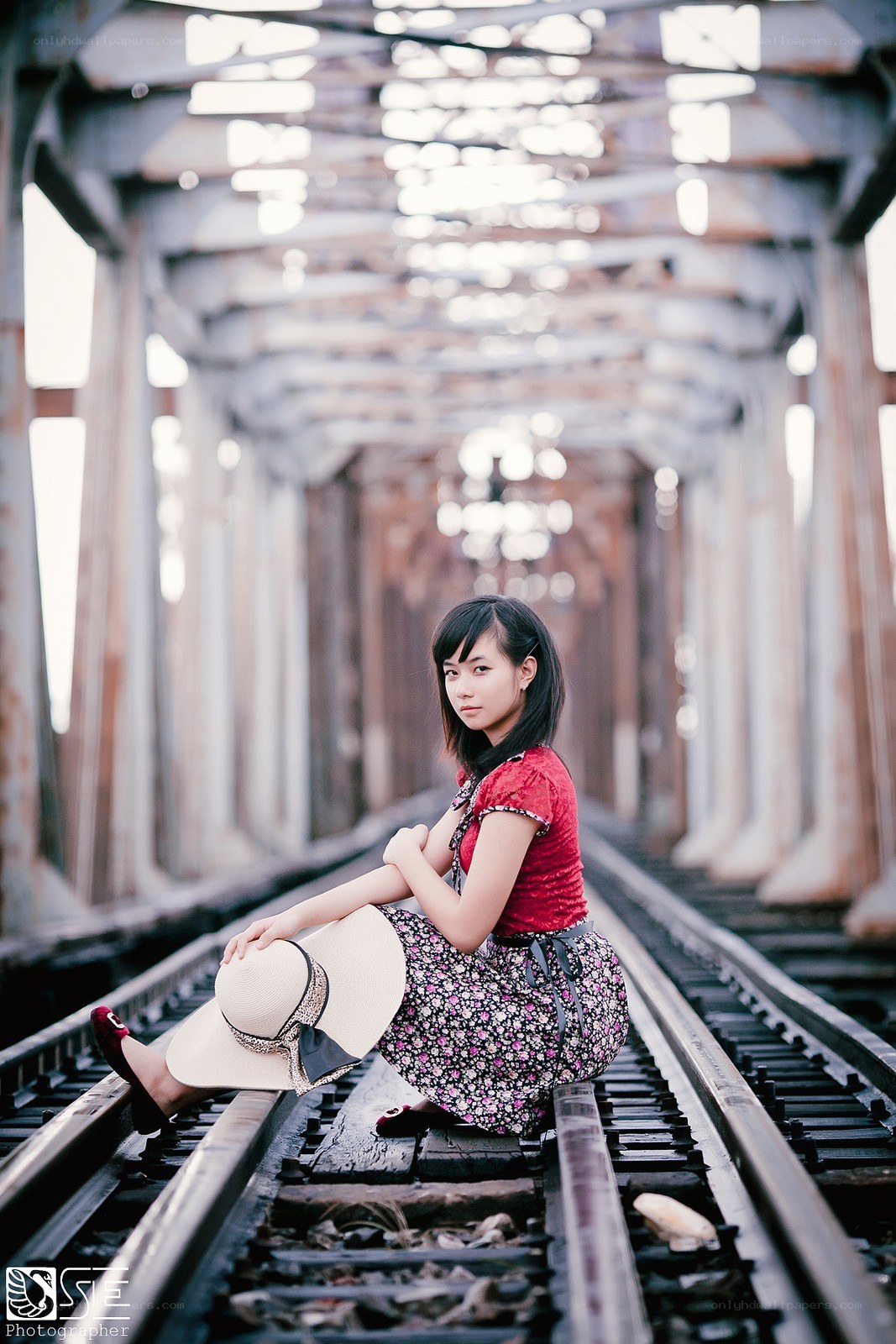 Woman on a train bridge